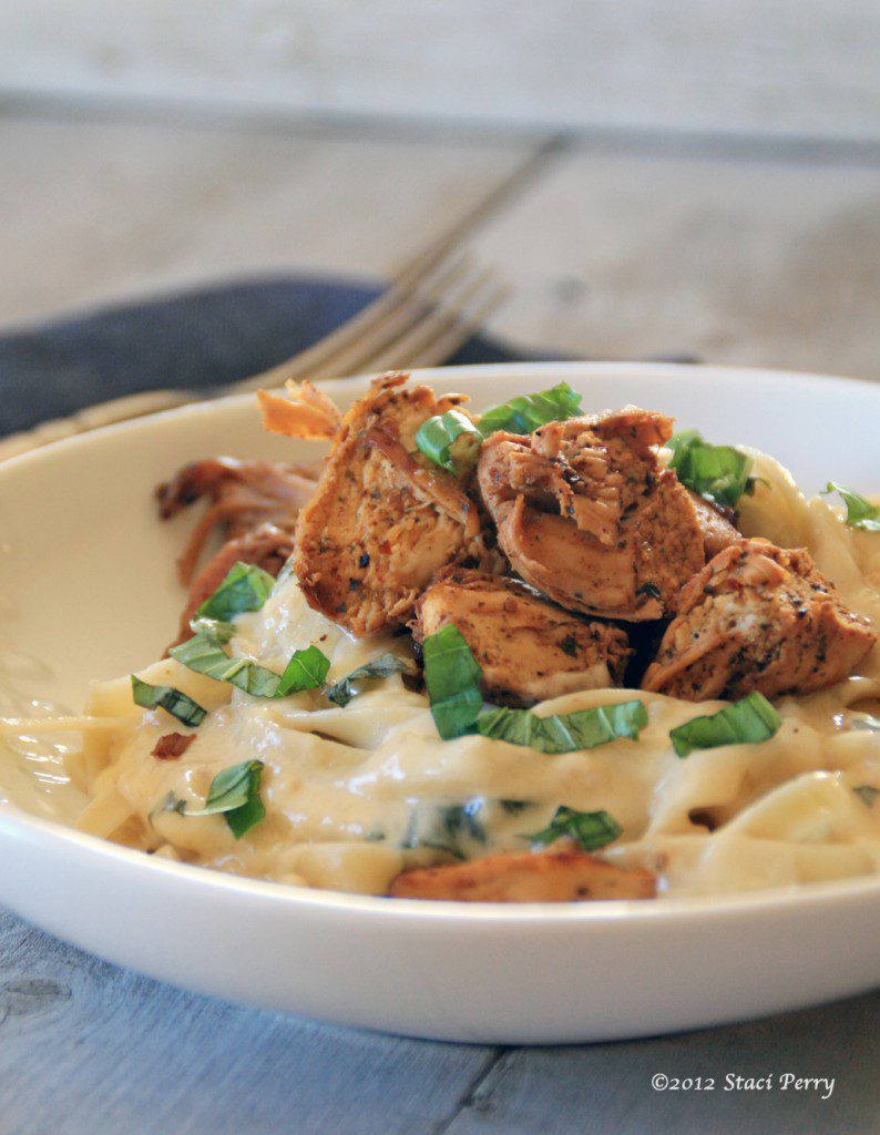 chicken garlic asiago Italian sauce fettuccine pasta on a plate