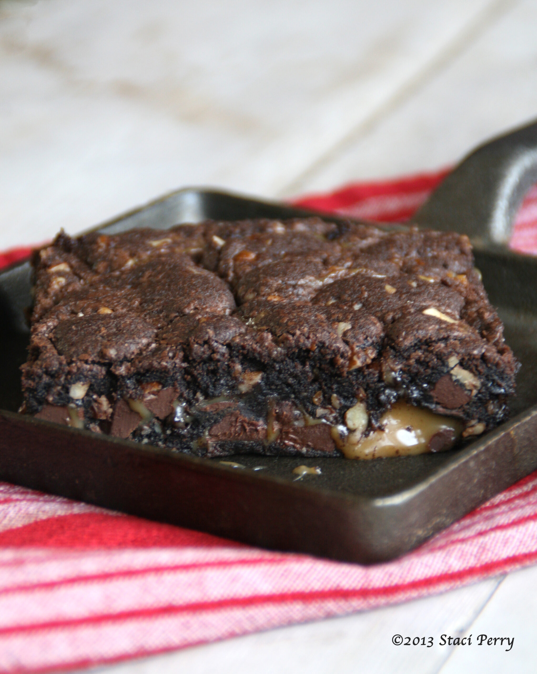 plate with a caramel brownie