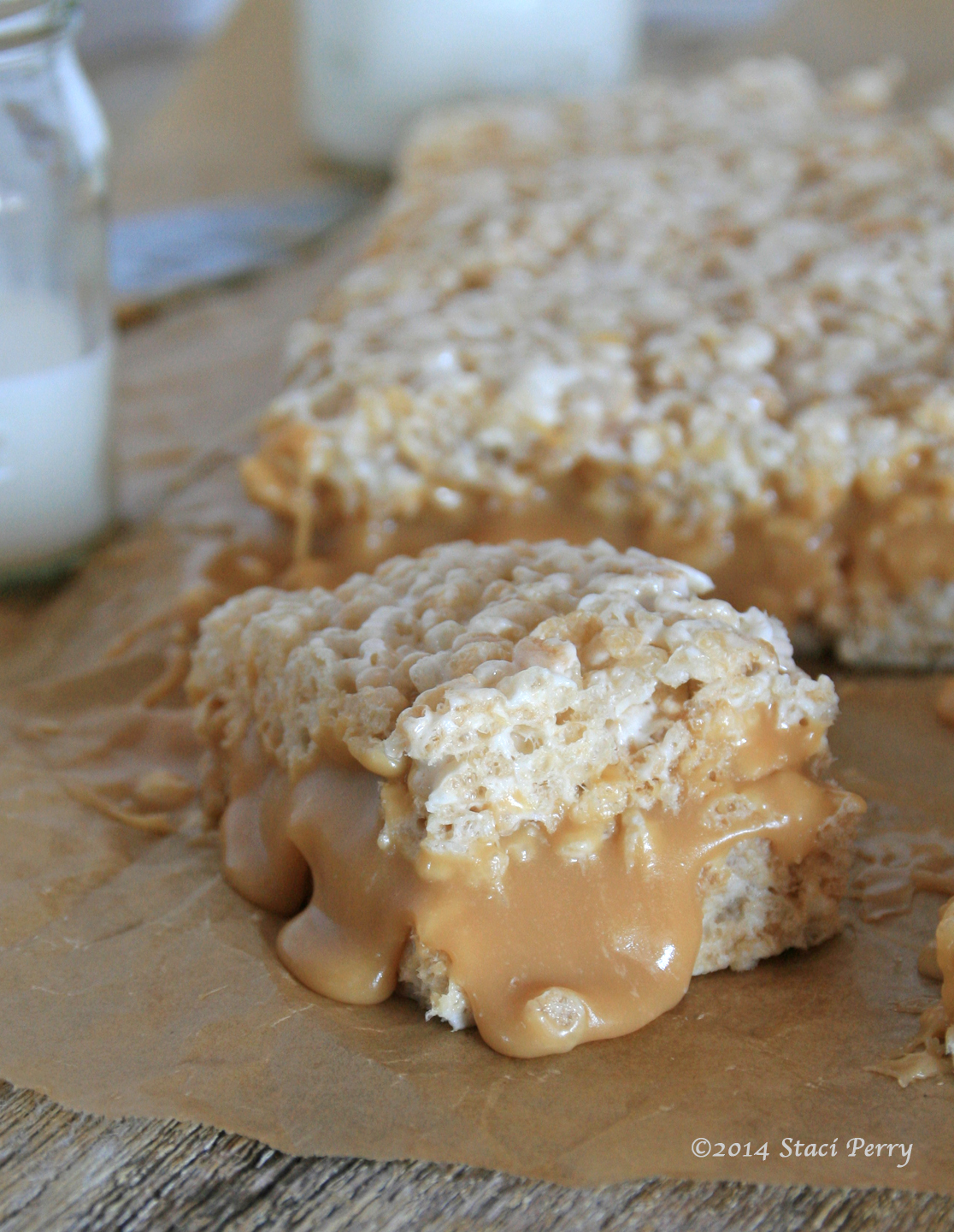 rice Krispy bar with lots of caramel oozing out of the middle