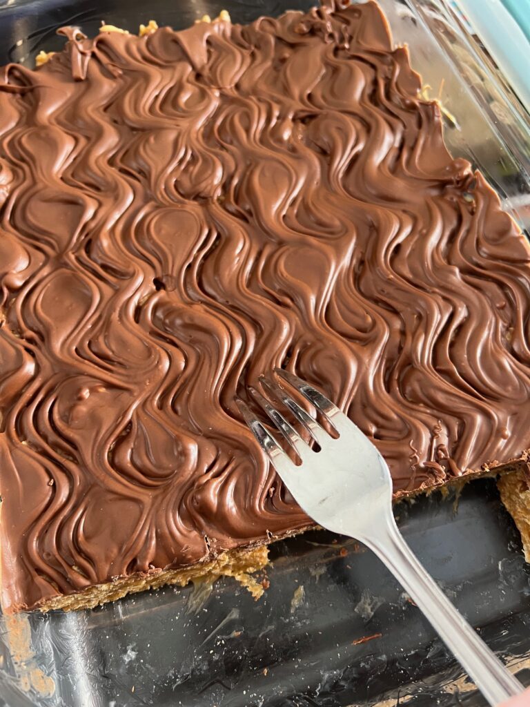 pan of Special K or scotcharoo bars with a swirl pattern from a fork