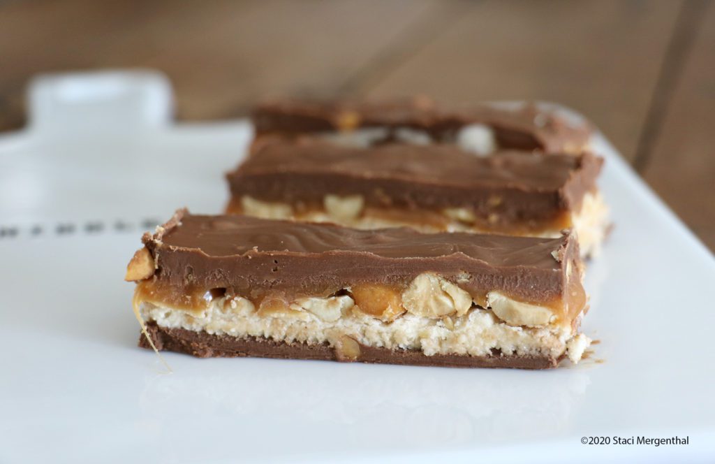 homemade no-bake Snickers candy bars with caramel peanut butter nougat