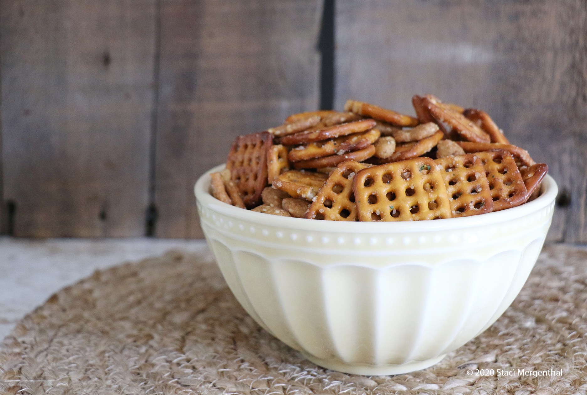 bowl of spicy pretzels and sesame sticks