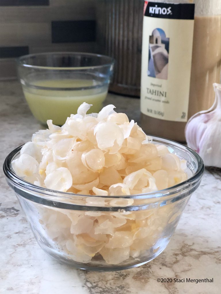 bowl of skins removed from chickpeas