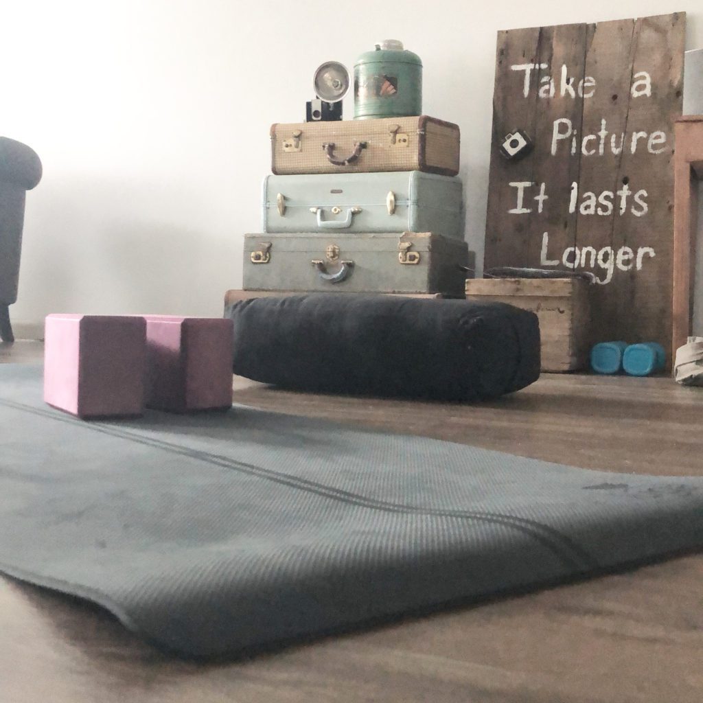 yoga mat rolled out on floor