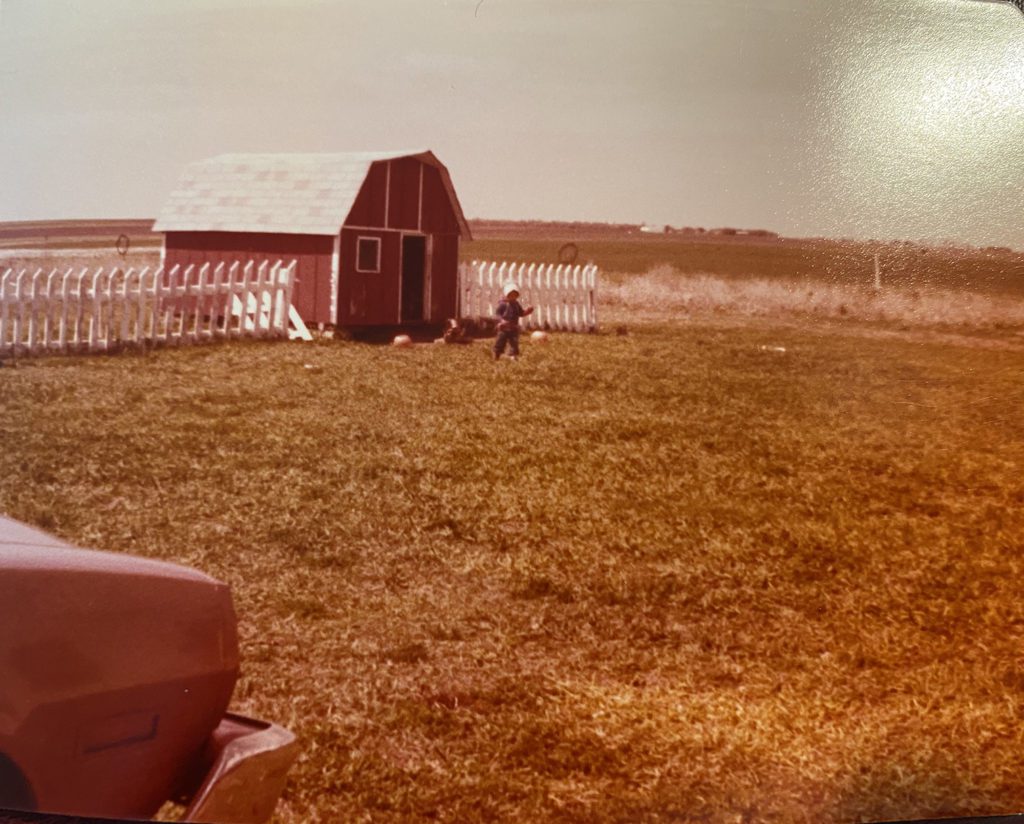 red play barn with white picket fence circa 1977