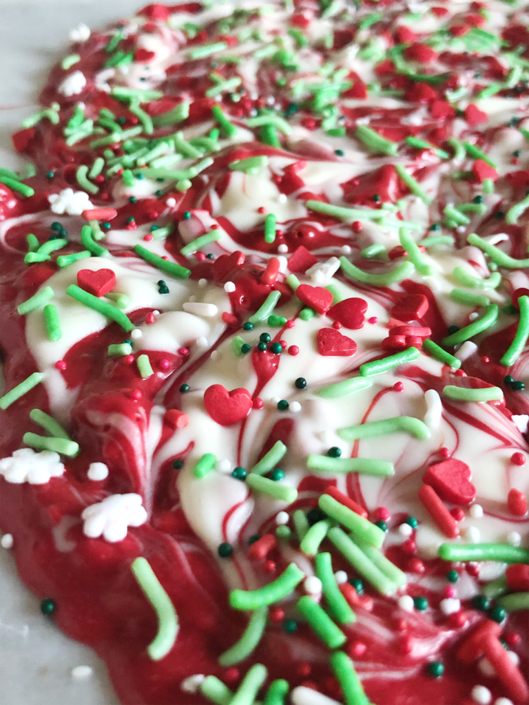 red and white almond bark swirled with sprinkles