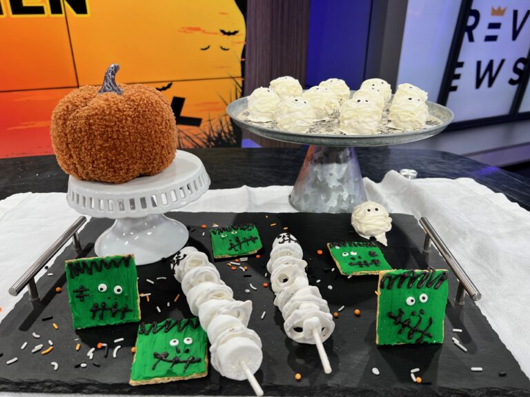mummy cake balls on cake stand and Frankenstein crackers and skeleton treats on tray