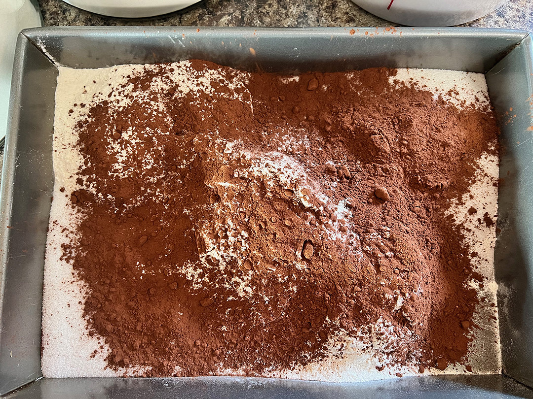 pan with cocoa and flour ingredients 