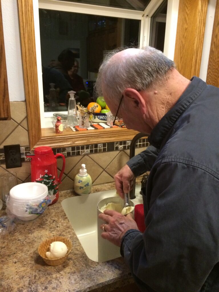 dad scooping homemade ice cream