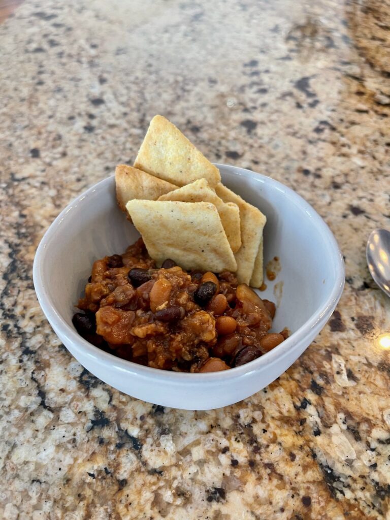 little bowl with slow cooker cowboy beans and crackers appetizers 