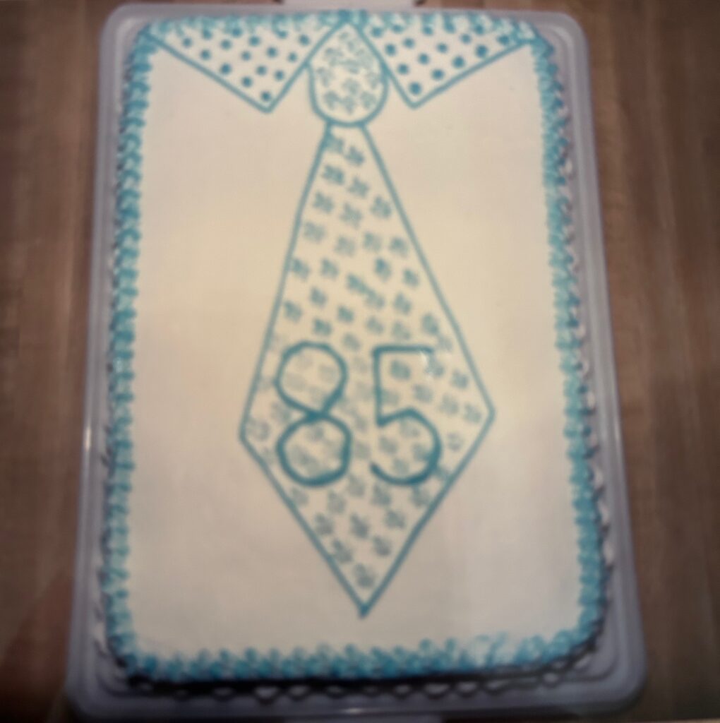 birthday cake with a tie and 85