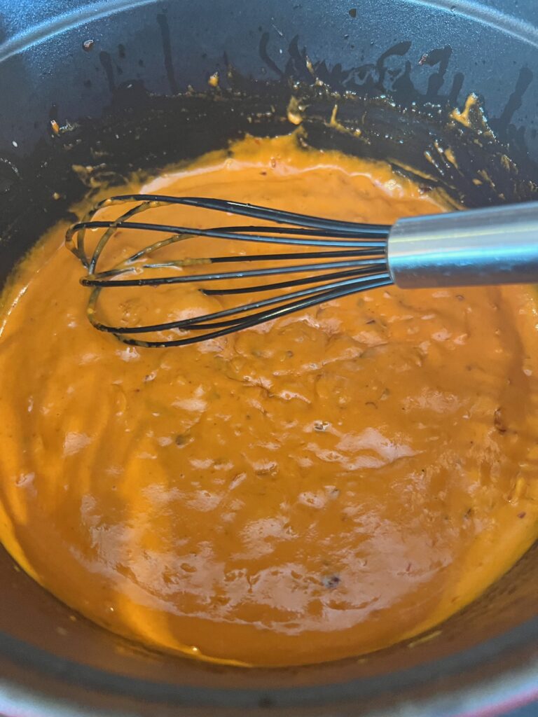 whisk the sauce in the pot