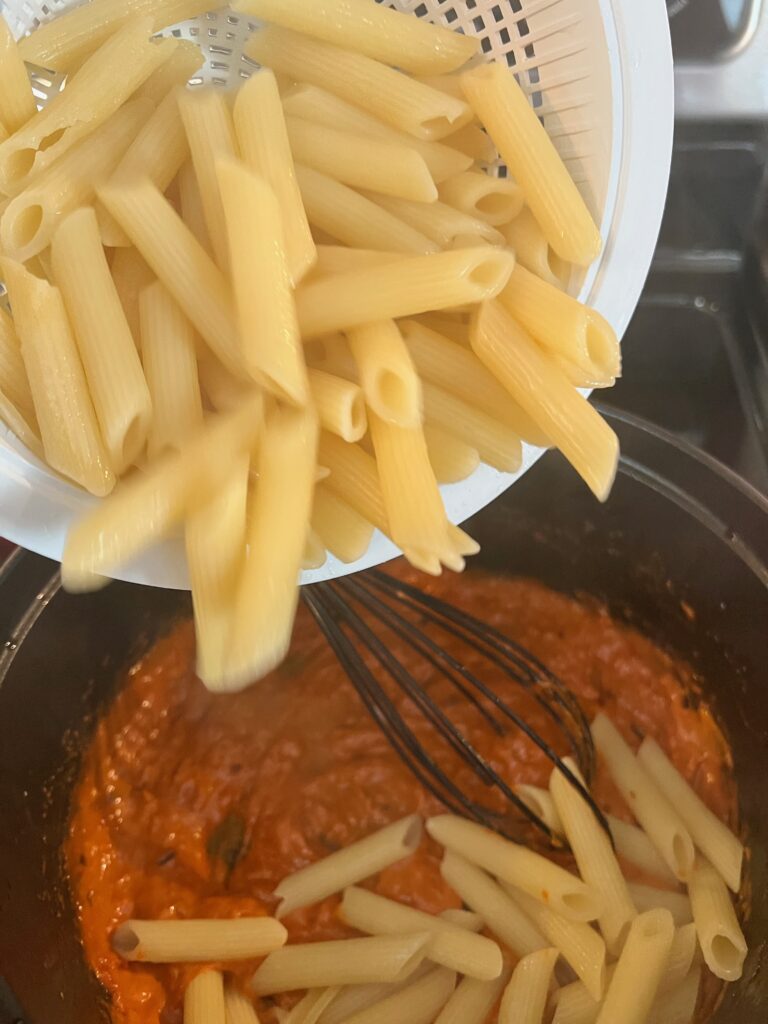 addd the cooked pasta to the red sauce 