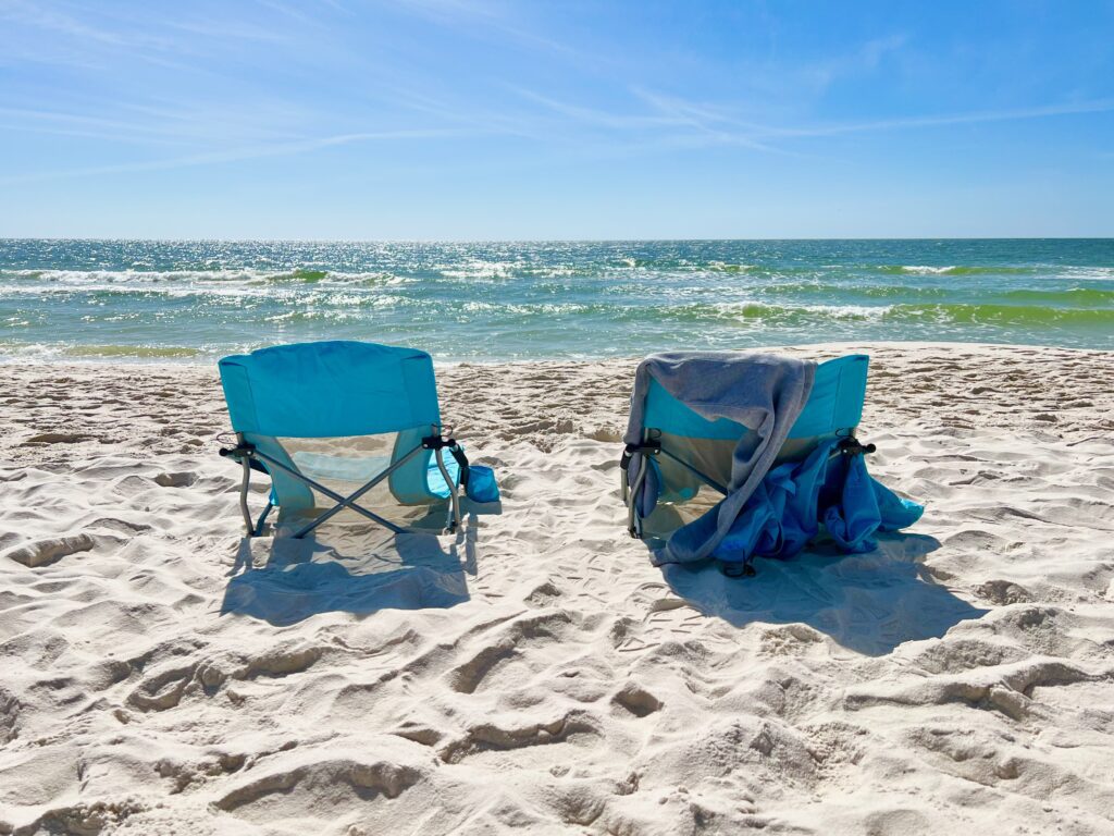 two beach chairs in the sand on the beach at Gulf Shores Alabama