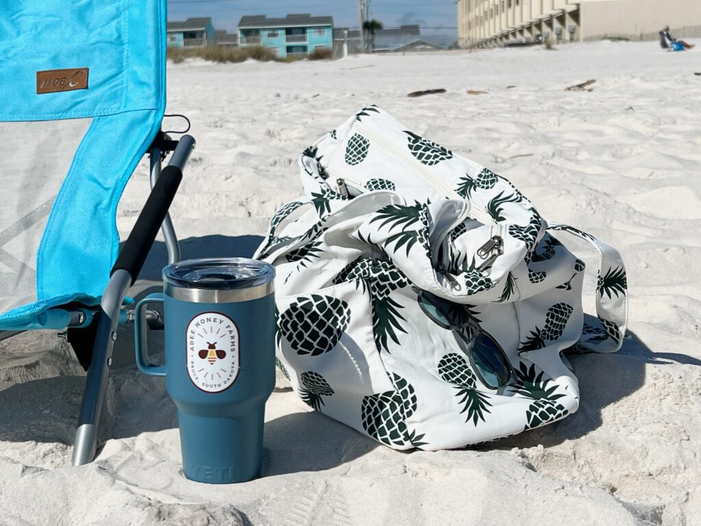 beach bag, chair and water jug in the sand at the beach Gulf Shores Alabama 