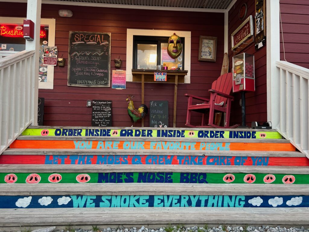 fun and brightly painted steps up to Moe's Original BBQ in Orange Beach Alabama