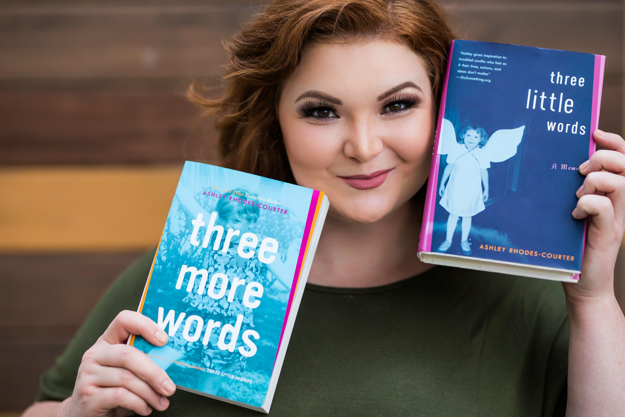 Ashley Rhodes-Courter holding Three Little Words and Three More Words books