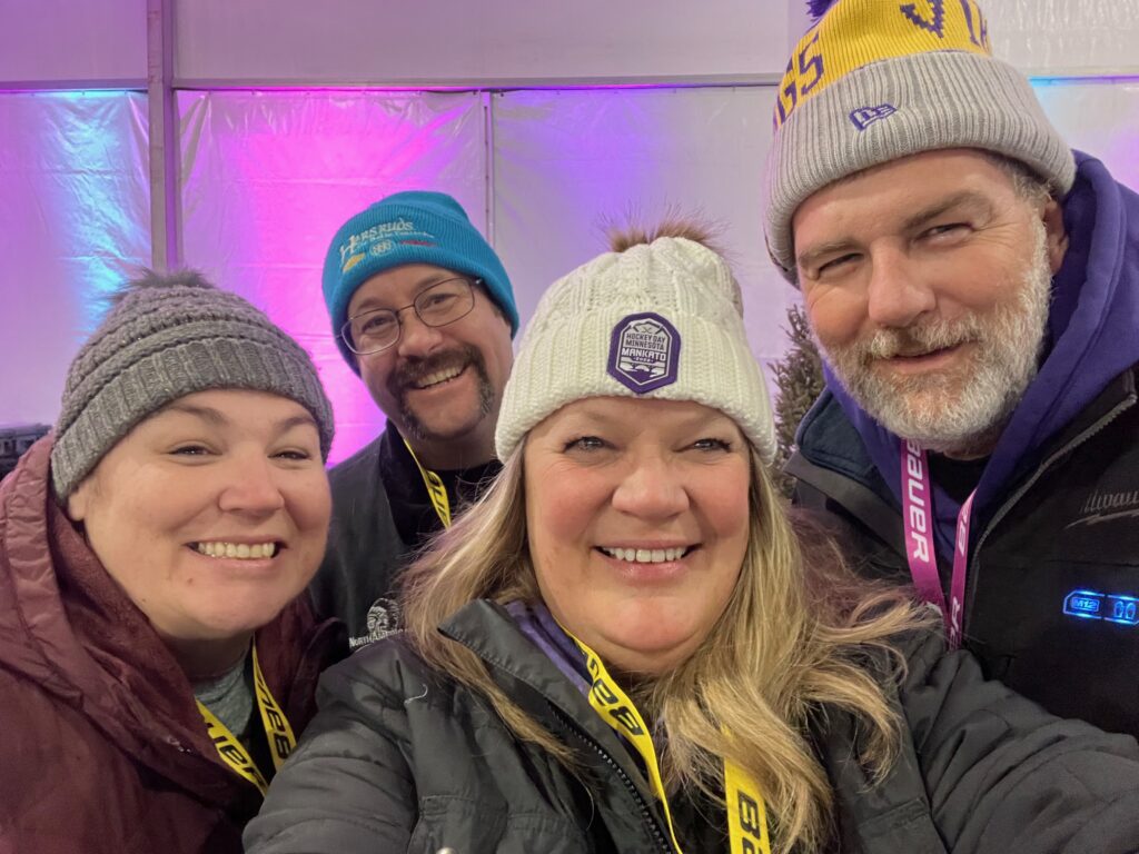 Betsy, Russell, Staci and Jason at Hockey Day Minnesota 2022