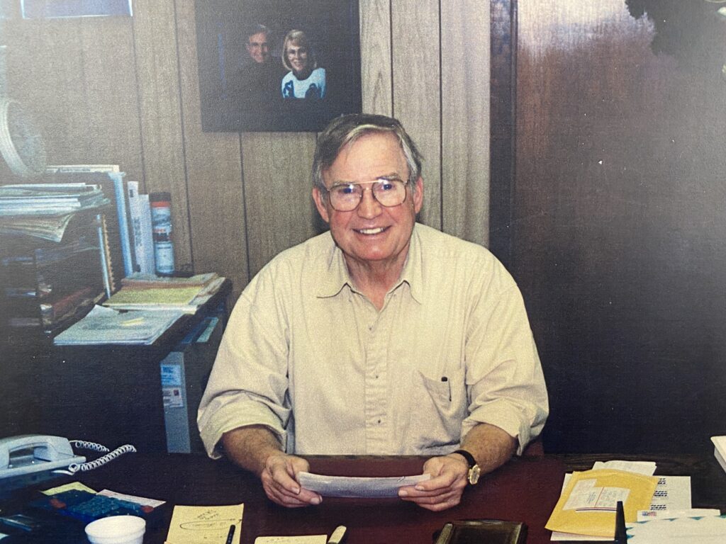 Richard Adee sitting at his desk