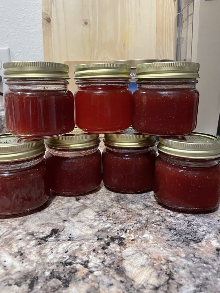 jars of homemade jam strawberry apricot