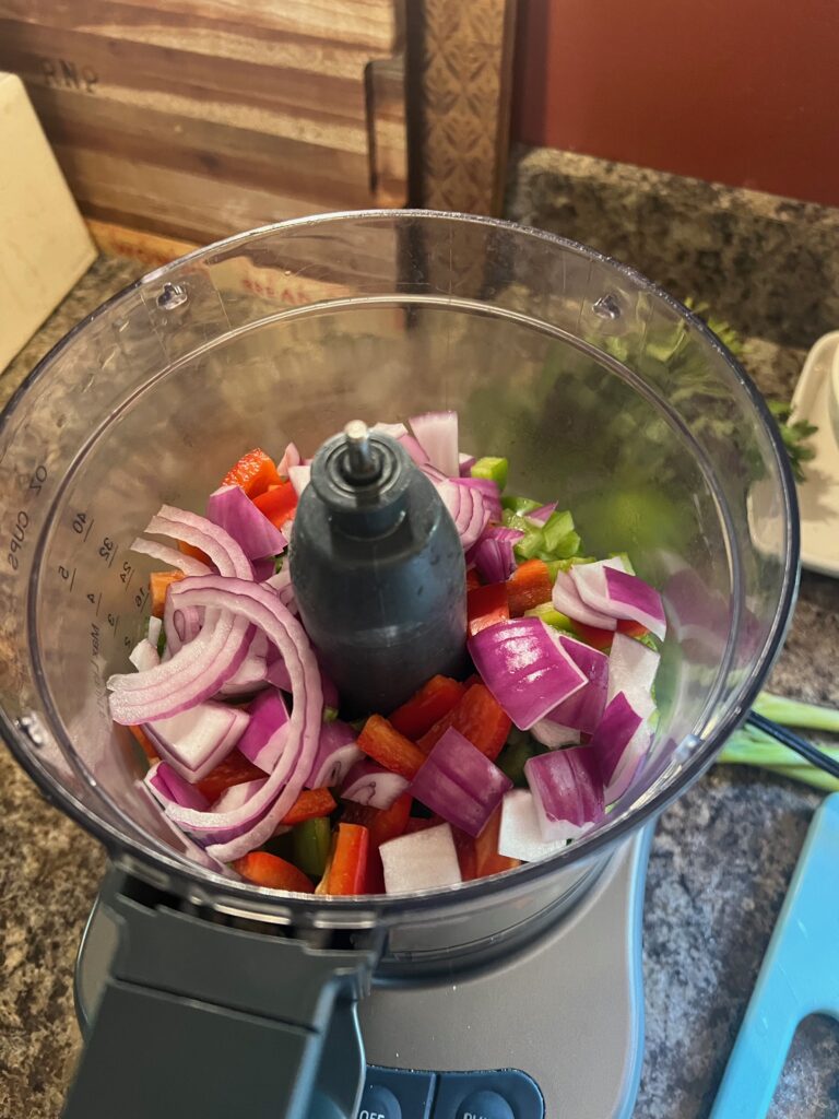 onions and peppers in a food processor for salsa