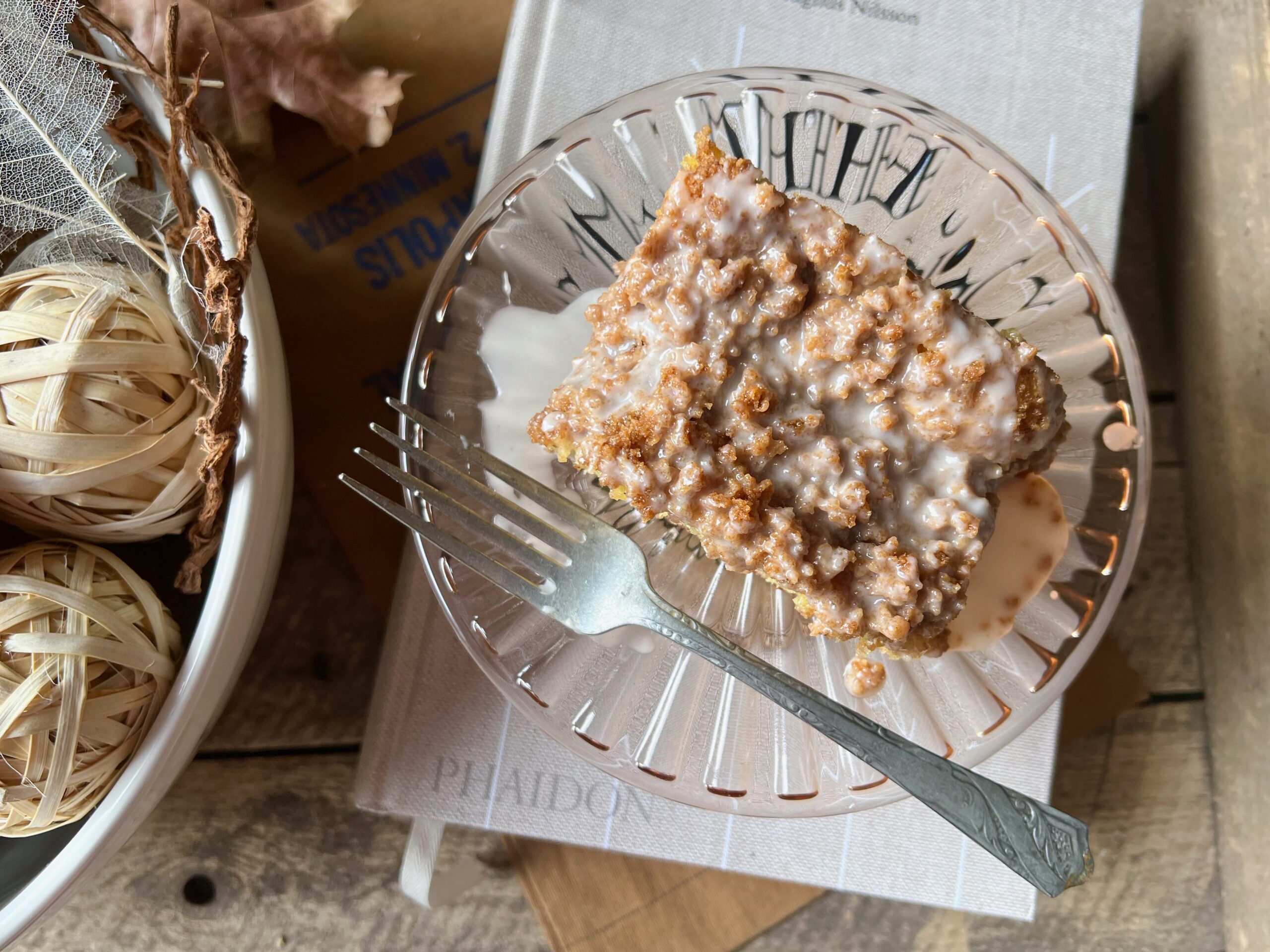 pink glass plate with slice of graham coffee cake and fork