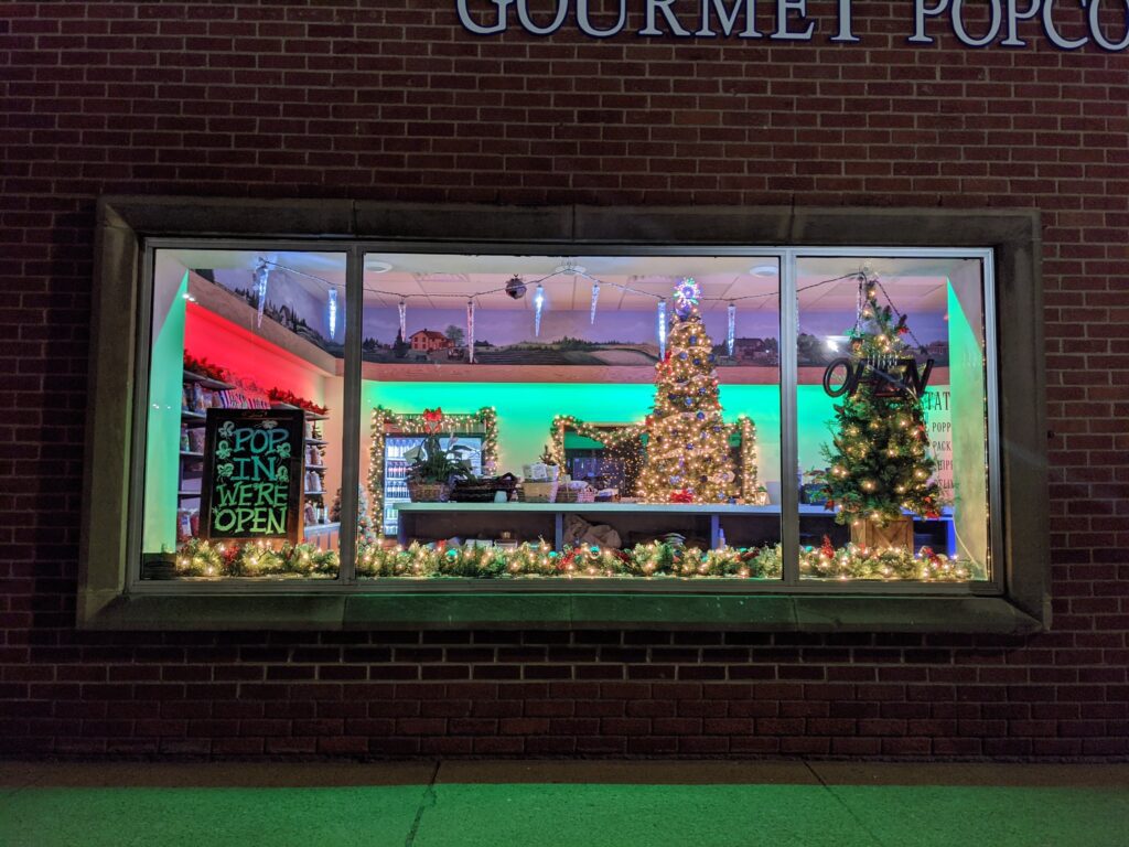 Christmas window display from the outside of Gaylen's Popcorn