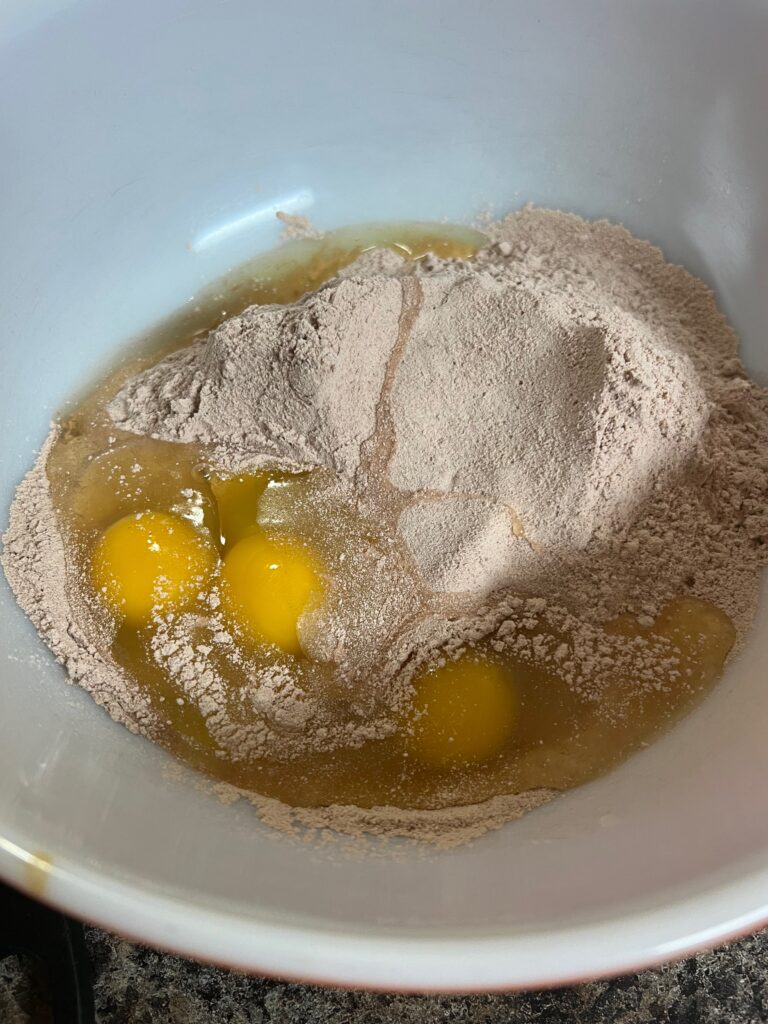 eggs added to cake mix in a bowl