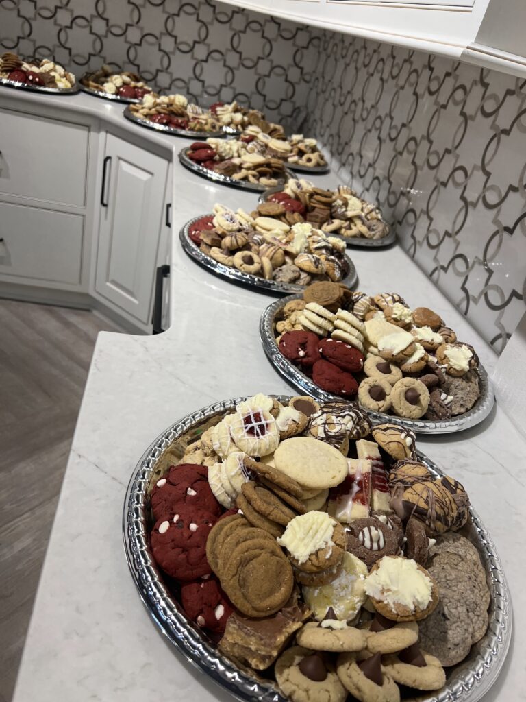line of platters piled with cookies