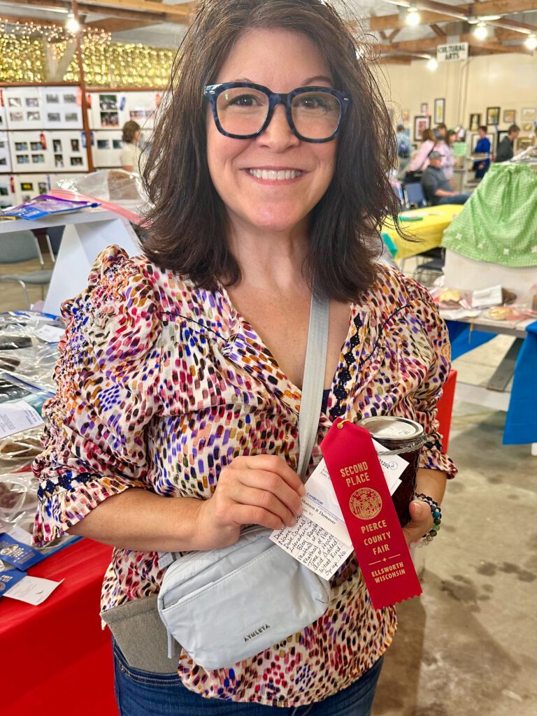 Shannon at the Pierce County Fair with red ribbon and raspberry jam