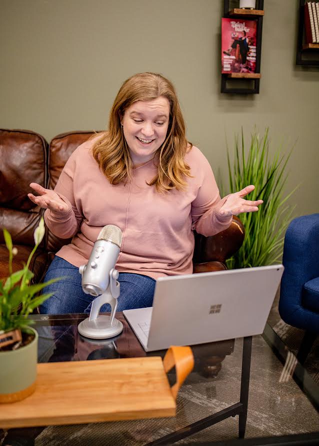 Amanda with a laptop and microphone 