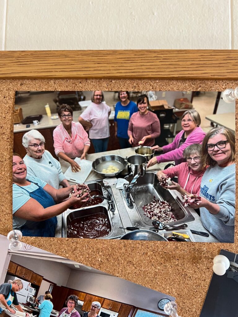 people in the church kitchen peeling potatoes to make lefse