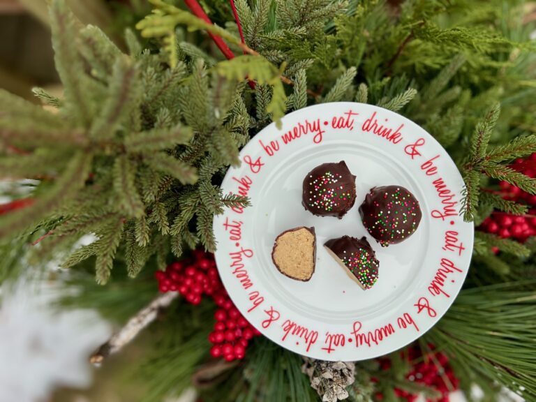 festive Christmas plate with three no-bake crispy peanut butter balls